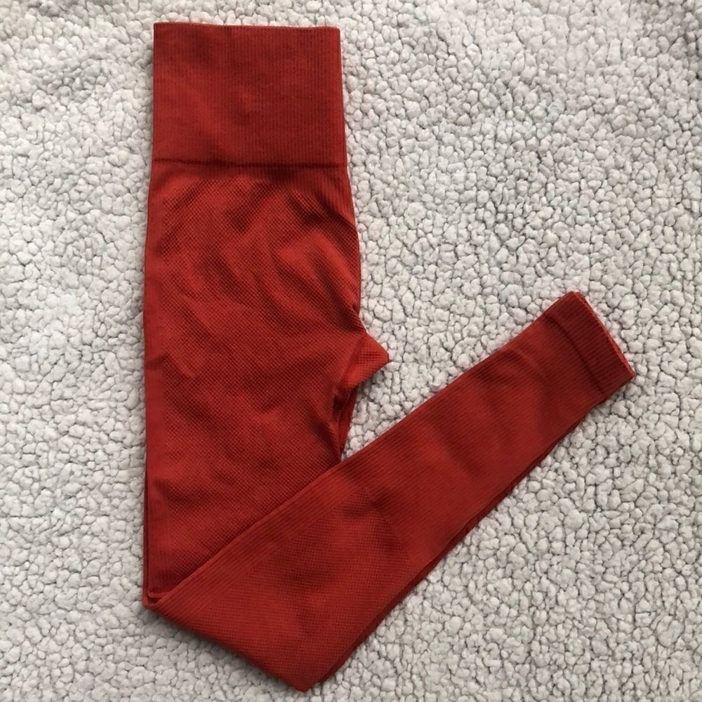 Orange high waisted yoga pants.  Size XS.